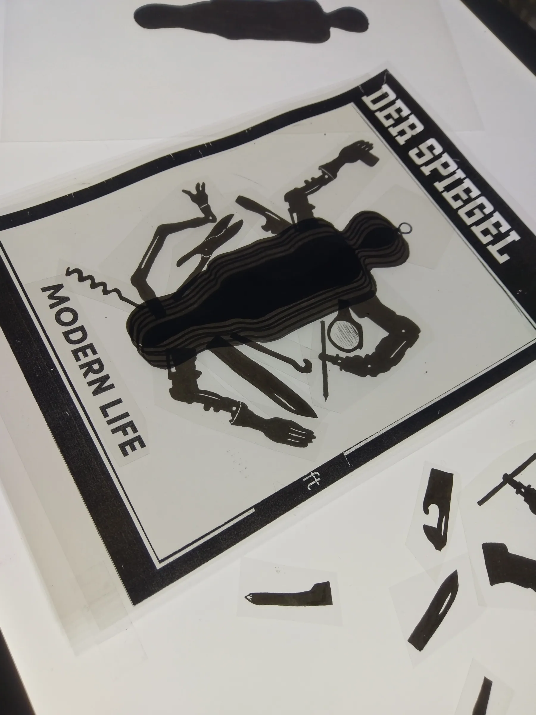 Black cut-out shapes casting shadows over a magazine cover titled Modern Life